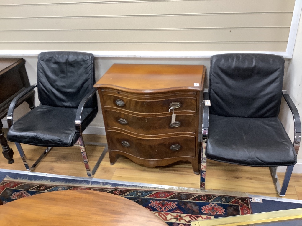 A pair of Knoll International Mies Van De Roue chrome and black leather cantilever elbow chairs, width 58cm, depth 64cm, height 86cm